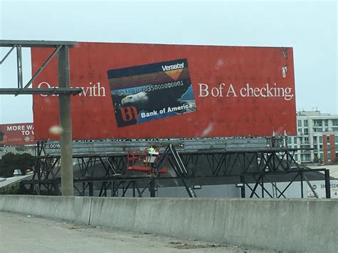 An Old Billboard For Bank Of America That Was Uncovered Prior To A New