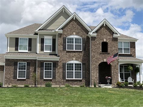 Beautiful shutters recently installed on a london. SCOTTSDALE BRICK, MONTEREY TAUPE HARDIE SIDING, WHITE TRIM ...