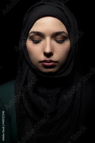 Female Wearing A Black Hijab As A Conservative Fashion Choice To