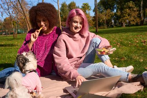 joyous ladies having picnic on grass in public park stock image image of women morning 274420627