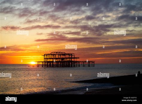Brighton And Hove West Pier Ruins At Sunset With The Golden Disc Of