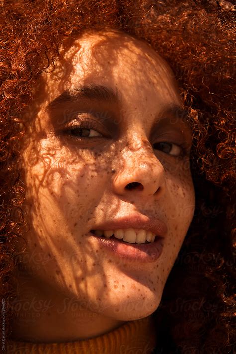 Closed Portrait Of A Young Red Haired Girl With Freckles Del Colaborador De Stocksy Claret