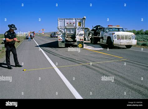 Police Investigate Traffic Accident And Measure Skid Marks From Tires