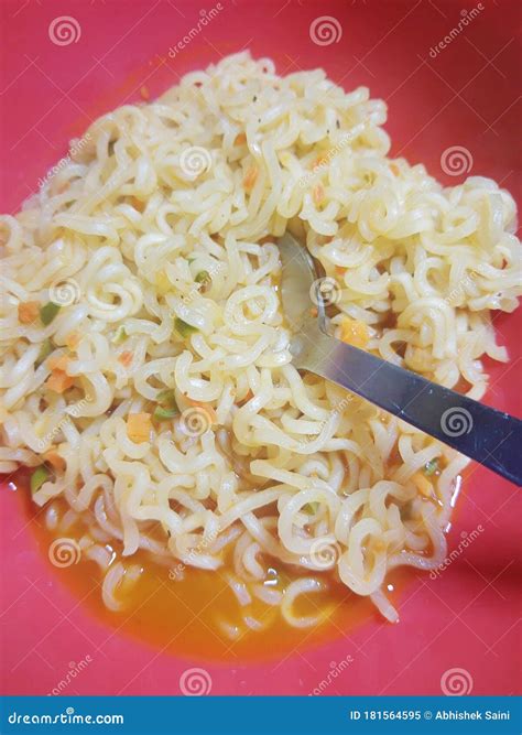 Famous Home Made Asian Instant Noodle In A Porcelain Bowl With Fork And Spoon Close Up Stock
