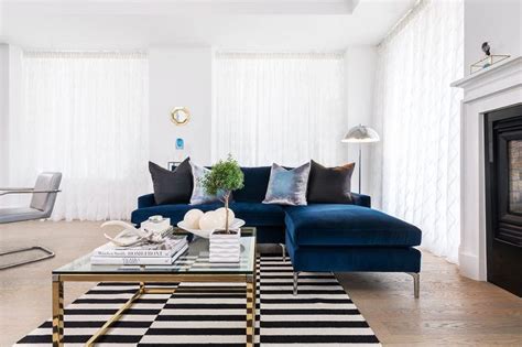 This stunning living room from dzhemesyuk design pairs dark woods and matte black walls with a stripe of dazzling gold. Black Velvet Sofa Design Ideas