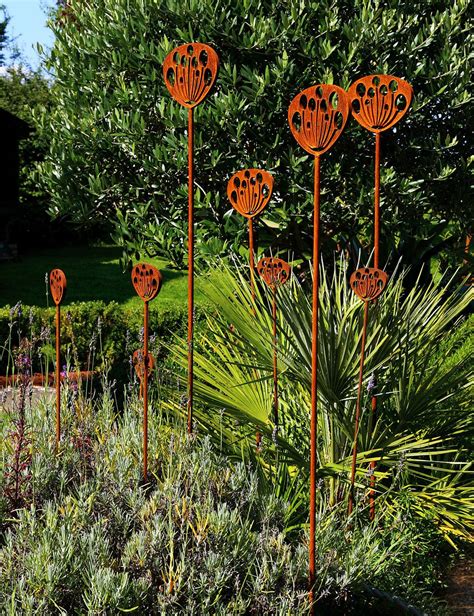 Garden Sculpture Crafted From Rusted Metal Inspired By The Seed Head