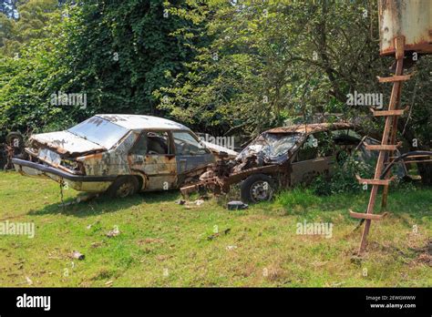 Old Abandoned Cars Rusting Away On A Farm Stock Photo Alamy