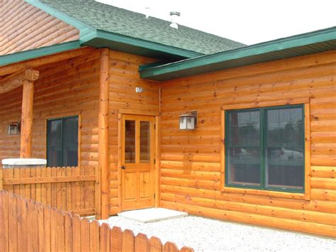 On inside corners you can rip down 2x2's to install first in the corner. Log Trim and Siding Trim