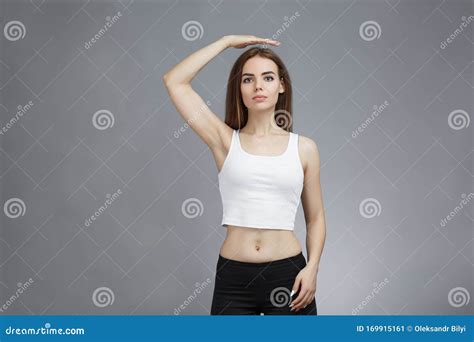 woman is holding her right hand above her head stock image image of emotion body 169915161