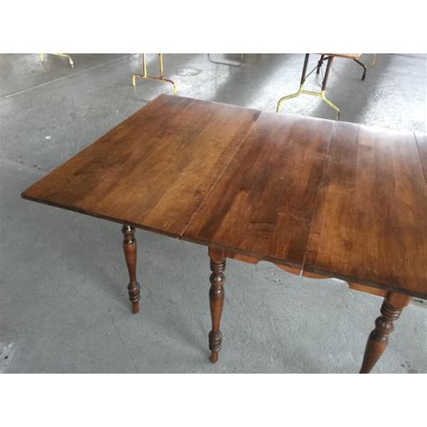 When unfolded, a drop leaf dining room table will typically have a square or rectangular top shape. Drop Leaf Extension Dining Table Walter of Wabash | Chairish
