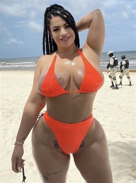 Model With Biggest Butt On Onlyfans Parades Around In Racy Orange