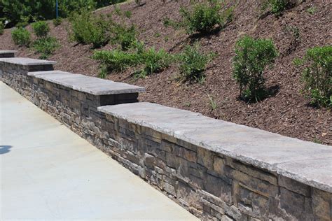 Walls Built On A Sloping Grade Require A Stepped Up Base To Remain