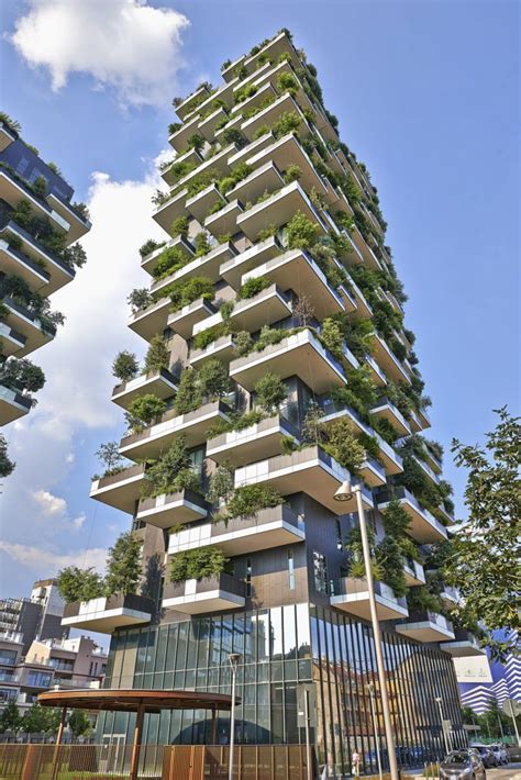 A Very Tall Building With Plants Growing On It