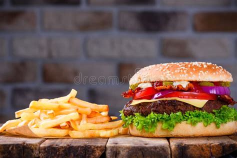 Delicious Fresh Hamburger With French Fries And Cola On Wooden Table