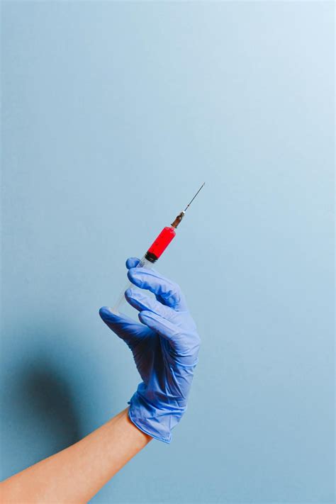 Nurse Holding Syringe · Free Stock Photo