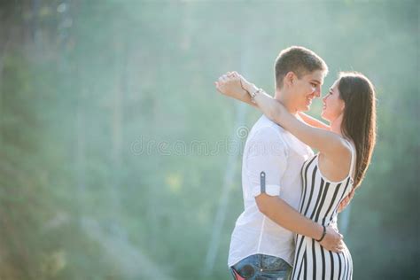 Happy Young Couple Kissing Outdoors Stock Image Image Of Cheerful