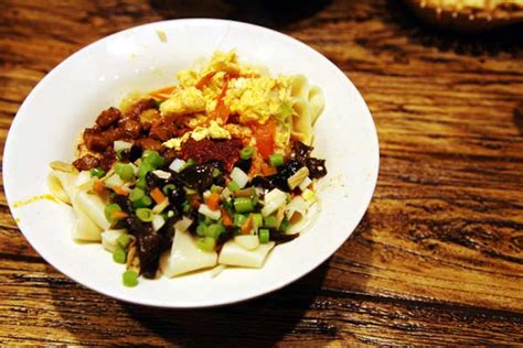 While purists argue that xi'an lacks a certain level of authenticity, culinary royalty and media (including anthony bourdain and zagat) have crowned xi'an a. US First Lady looks forward to Chinese cuisine-21food.com