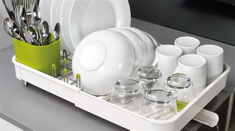 The drying rack comes with three water trays (one underneath the top tray, one at the very bottom, and one underneath the utensil holder on the side) to ensure no water spills onto your. Top 5 Best Dish Drainers - Space Saving Drying Racks