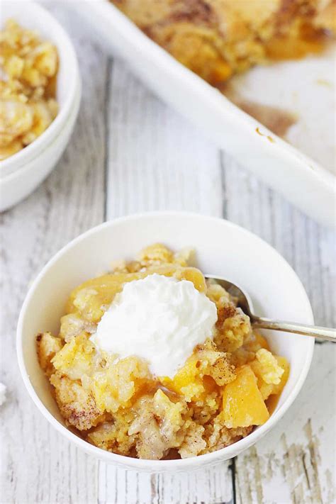 Top with the cake mix. Easy Peach Cobbler Dump Cake | Half-Scratched