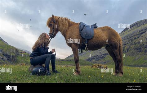 A Faroese Girl With Her Horse In Saksun Island Of Streymoy Faroe