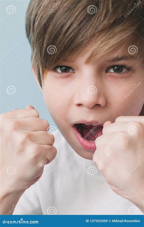 Boy Screams And Jokingly Threatens With His Fists Stock Image Image