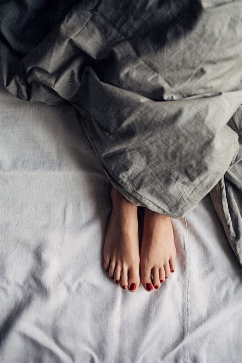 Womans Feet Under A Duvet By Stocksy Contributor Lumina Stocksy