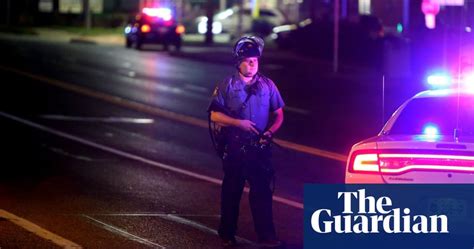 Two Suspects Sought After Shooting Of Ferguson Police Officer World News The Guardian