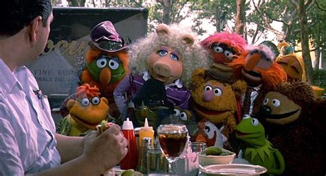 The Muppets Are Sitting At A Table Eating Food And Talking To Each Other