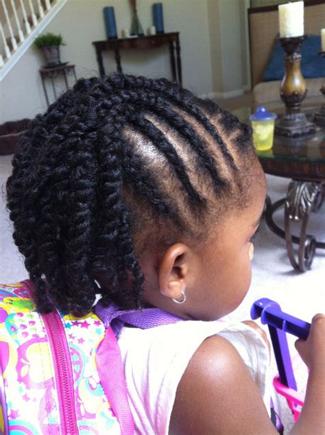 Cornrows & twisted bangs with pigtails. Kids Braid Hairstyle
