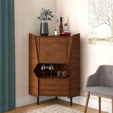 Creating a bar corner in the house means reserving space for the preparation of drinks and cocktails. Wrought Studio Hester Corner Bar Cabinet & Reviews | Wayfair