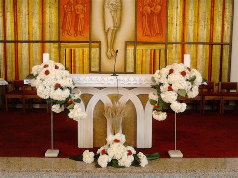 The Altar Is Decorated With White And Red Flowers