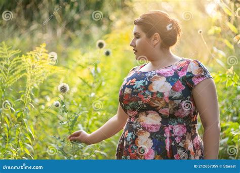 Plus Size Model In Floral Dress Outdoors Beautiful Fat Woman With Big Breasts In Nature Stock