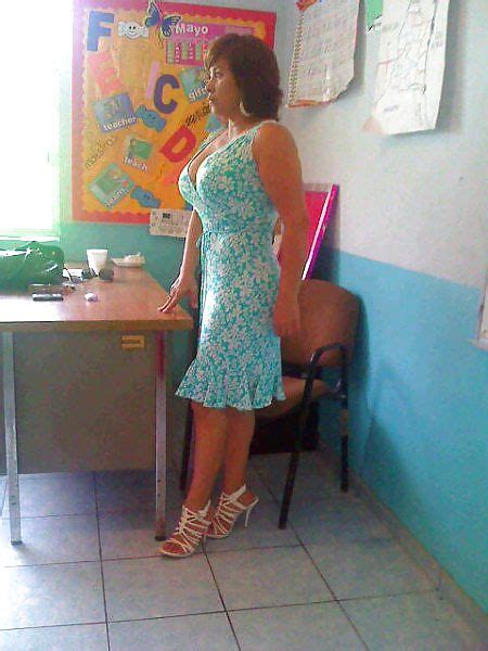 A Woman Standing In Front Of A Desk