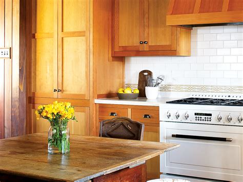 The design of a kitchen is tied closely to the layout. How to Refinish Kitchen Cabinets - Sunset Magazine