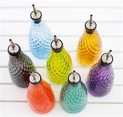 Handmade Glass Oil And Vinegar Bottles By Mdina Glass In A Range Of Colours That Will Grace Any