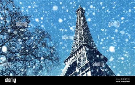 Eiffel Tower In Paris On A Winter Day Snowfall In Paris Stock Photo