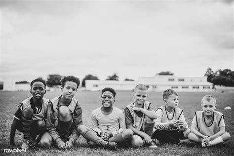 Junior Football Team Sitting On The Grass Premium Image By Rawpixel