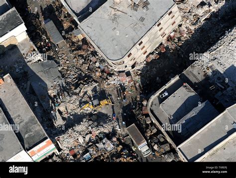 A Backhoe Removes Debris In Downtown Port Au Prince On January 24 2010