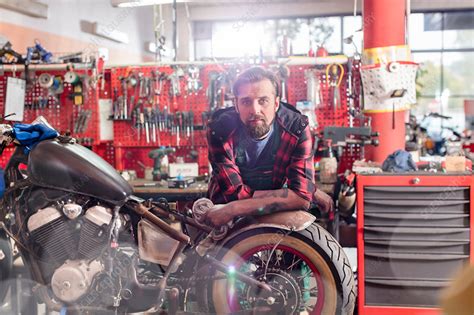 With computer systems being integrated more often, it is essential for mechanics to keep on learning. Serious motorcycle mechanic - Stock Image - F018/6824 ...
