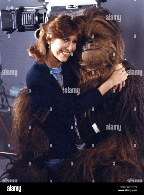 Carrie Fisher And Peter Mayhew In Costume As Chewbacca On The Set Of