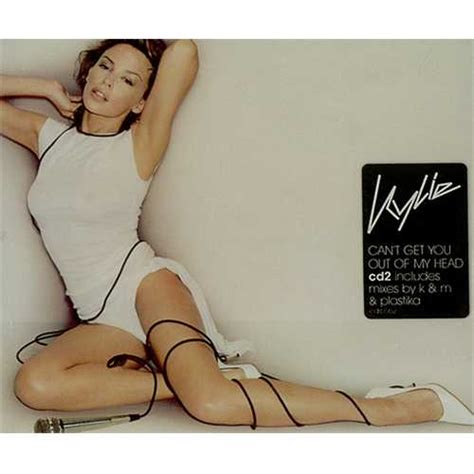 The coach is a woman with curly light blue hair in a bob. Kylie Minogue Can't Get You Out Of My Head UK 2-CD single ...