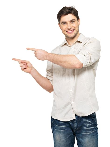 Free Photo Young Smiling Man Points With Fingers In The Right Side