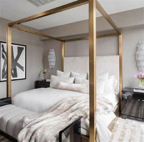 In a small bedroom consider using the space underneath the bed, behind the door or under the ceiling. Elegant modern bedroom with a beautiful color scheme of black, white, grey, and gold ...