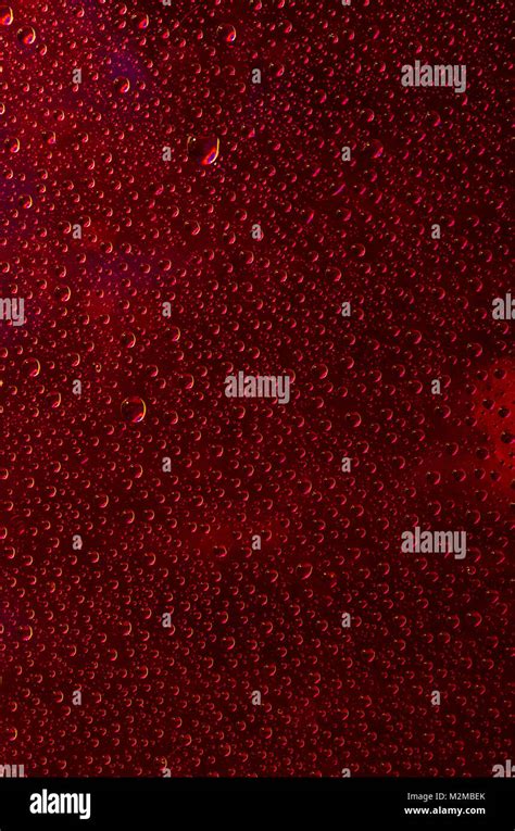 Red Background Of A Rainbow Of Water Droplets Stock Photo Alamy