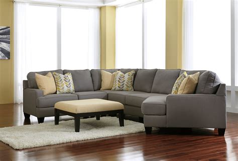 This living room furniture style offers versatile modular design, a plus if you enjoy rearranging your decor. Chamberly Alloy RAF Cuddler Sectional from Ashley (2430275 ...