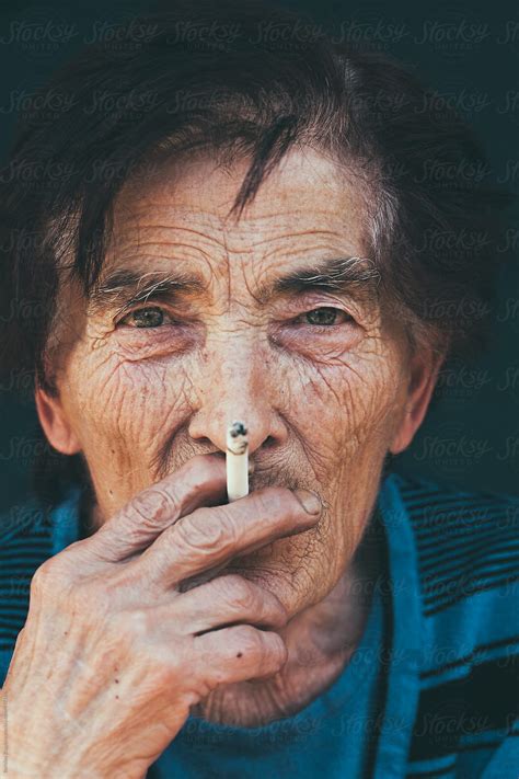 Portrait Of An Senior Woman Smoking By Stocksy Contributor Borislav