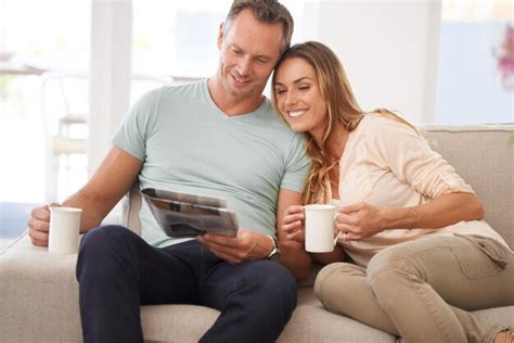 Premium Photo Love Newspaper And Couple On A Couch Smile And Bonding