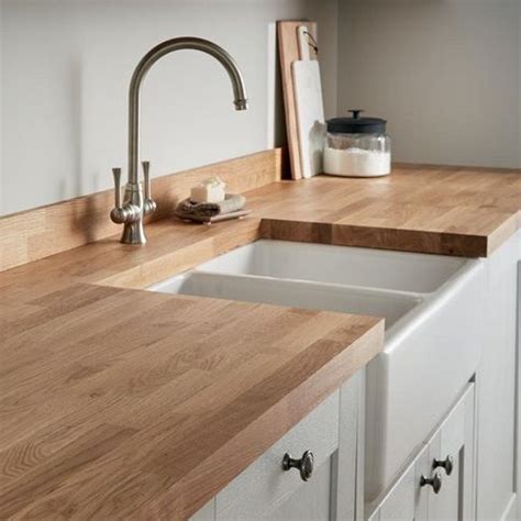 Grey kitchen cabinets oak worktop 40mm = cmt. https://www.howdens.com/kitchens/kitchen-surfaces/worktops ...