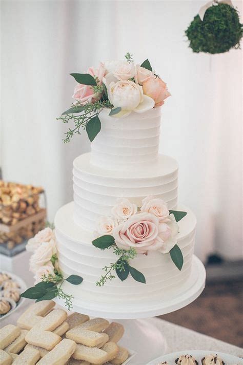 Cupcakes decorated with dainty floral icing and pearl adornments are a match made in heaven for vintage wedding themes. 20 Simple Elegant Wedding Cakes for Spring/Summer 2021 ...
