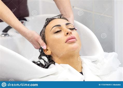 The Girl With Closed Eyes Washes Her Hair In A Beauty Salon Stock Image